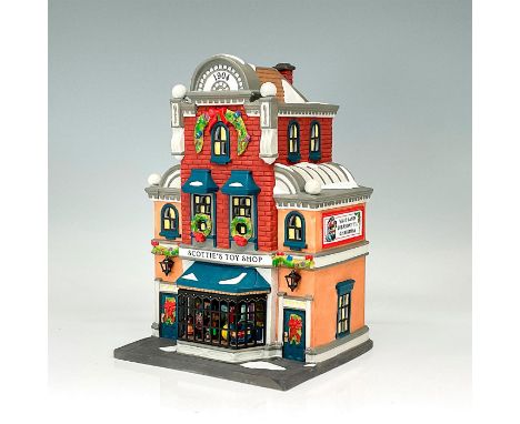 Part of the Heritage Village Collection. Porcelain figure featuring a toy shop with tiny toys in the window. Includes four tr