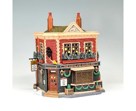 Part of the Dickens' Village Series. Hand-painted porcelain figure modeled as a Victorian style pub with lavish Christmas dec