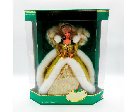 Special Edition. #12155. Blonde Barbie Collectible dressed in luxe gold shiny dress with fur trim and holly berry accents.In 