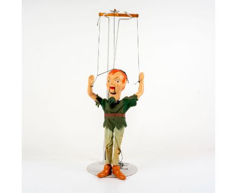 Lost boy Peter from Neverland as a puppet made of composite, wood, and cloth. Issued: c. 1950Dimensions: 3.25"L x 5"W x 14.5"