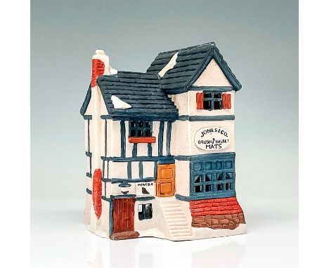 Part of the Dickens' Village Series. Hand-painted porcelain figure modeled as a Victorian style storefront. Light switch cord