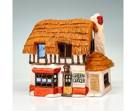 Part of the Dickens' Village Series. Hand-painted porcelain figure modeled as a Victorian style storefront. Light switch cord