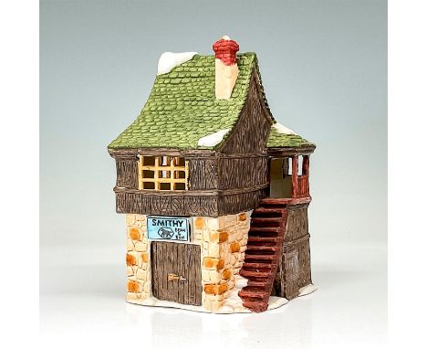 This figurine depict a quaint stone village shop with the signage posted above the door and a set of stairs. This item has it