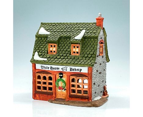 Part of the Dickens Village Series. Hand painted porcelain, depicting quaint Tudor style stone bakery shop with light feature