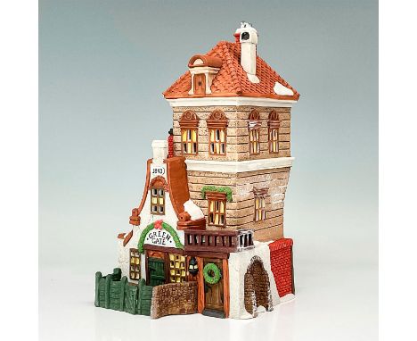 Part of the Dickens' Village Series. Hand-painted porcelain figure modeled as the Green Gate Cottage with snow laden eaves an