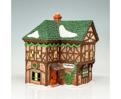This figure shows a rustic village shop in a winter setting. This item has its original box. Original box's dimensions: 9.5"L