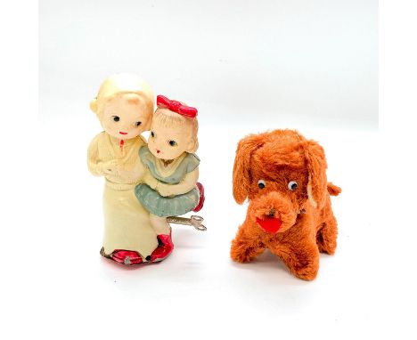Includes: first in celluloid depicting two girls skating together (Occupied Japan), and second depicting cute brown material 