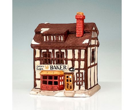Part of the Shops of Dickens' Village Series. Hand-painted porcelain figure modeled as a Victorian style storefront. Light sw