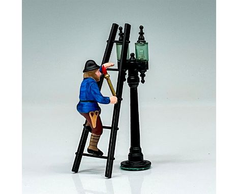 A village lamplighter on a ladder preparing to do his work. Vintage black torch lamp included. Dimensions of the larger item:
