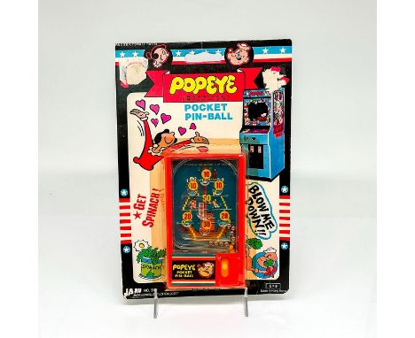 Still in blister card with great graphics, plastic pin ball toy. This item has its original box. Issued: 1983Dimensions: 6"L 