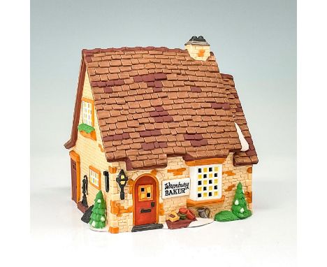 This figure depicts a cottage style bakery made of pale yellow bricks. This item has its original box. Original box's dimensi