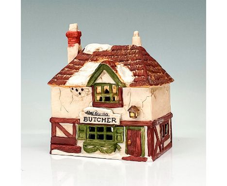Part of the Dickens' Village Series. Hand-painted porcelain figure modeled as a Victorian style storefront. Light switch cord