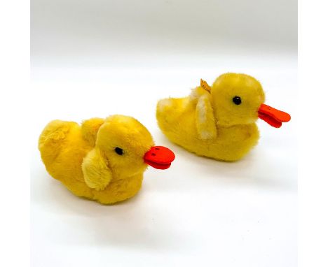 Depicts adorable ducklings with orange felt beaks in resting pose. Steiff metal and material tag attached. Dimensions: 5.5""L
