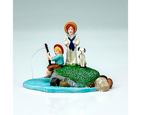 This figure shows two children fishing on a lake while on top of a mossy rock with their dog. This item has its original box.