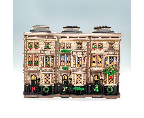 Part of the Dickens Village Series. Hand painted porcelain, depicting quaint brownstone homes with red, green, and yellow Chr