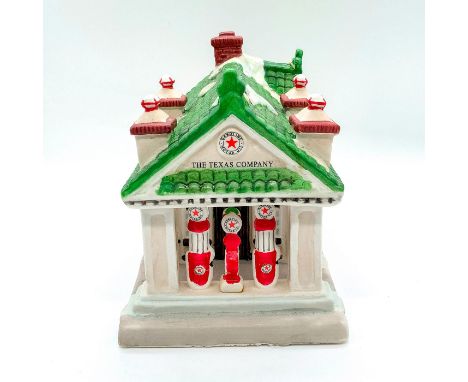 First in a limited edition series. Depicts gasoline station decorated in festive wreaths and snow covered green roof. With li