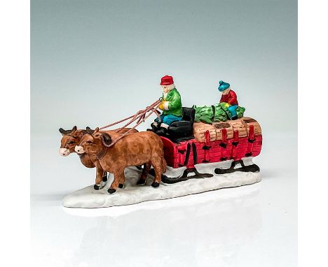 Part of the Heritage Village Collection. Hand-painted porcelain figure of an Ox pulled Wagon with driver, helper, and Christm