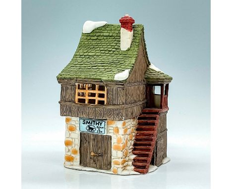 Part of the Dickens Village Series. Porcelain, depicting quaint blacksmith shop with light feature. This item has its origina