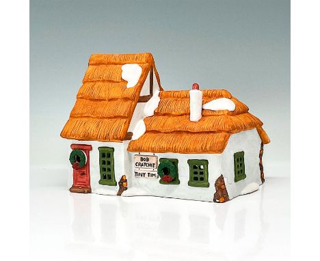 This figure shows a small white village cottage with snow on the roof. This item has its original box. The original box's dim