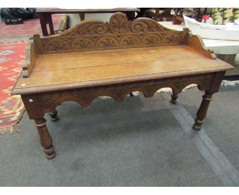 A medium oak hall bench