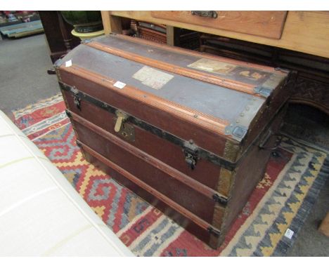 A Victorian canvas and wood domed travel trunk