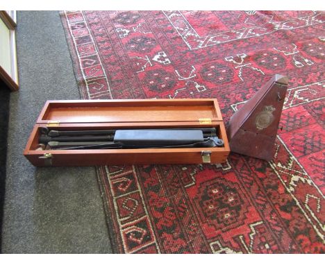 A hardwood cased metronome and a music stand