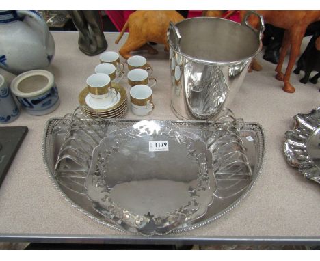 A silver plated champagne ice bucket, tray, pair of toast racks and dish, white and gilt coffee cans and saucers 