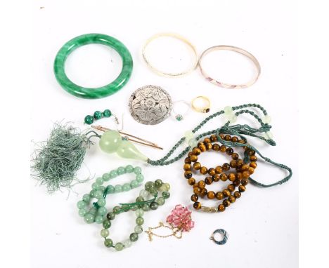 An unmarked yellow metal stone set bar brooch, a 9ct gold and pink stone set necklace, jade and jadeite bangle and necklace, 