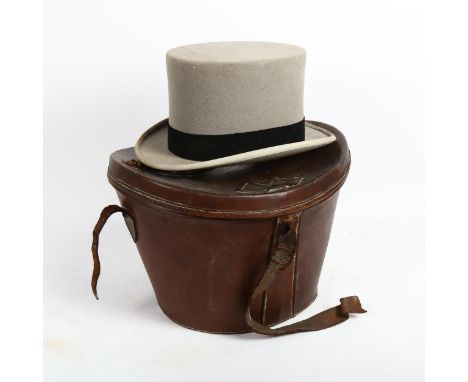 A Victorian grey top hat, by Army &amp; Navy Stores Ltd, in brown leather travelling case 