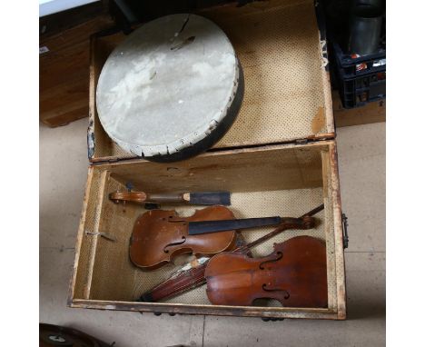 A trunk containing various musical instruments, and a parasol 