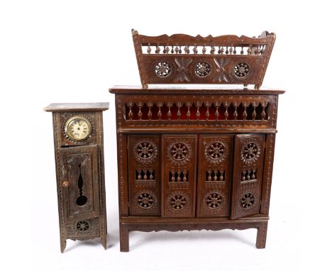 A French carved wood table-top cabinet, 44cm, a similar crib, and miniature longcase clock