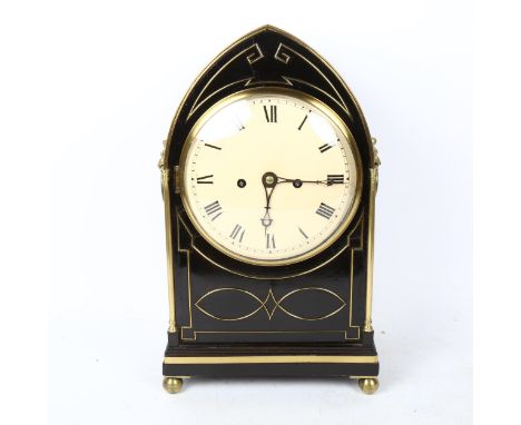 An ebonised lancet-top 8-day bracket clock, cream dial with Roman numeral hour markers, and lion ring handles, case height 41