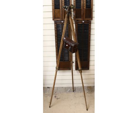 An early 20th century surveyor's level, by E R Watts &amp; Son London, serial no. 14775, on tripod stand with fitted leather 