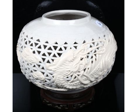 A Chinese Nan Yang ceramic lamp base, and carved hardwood stand, overall height 27cm 