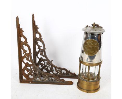 An early 20th century chrome and brass Protector miner's oil lamp, and a pair of cast-iron wall brackets, 25cm x 20cm (2) 
