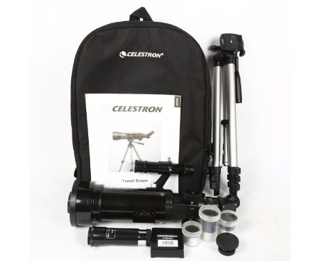 A Celestron travel scope 70, with tripod and instruction manual, in original case 