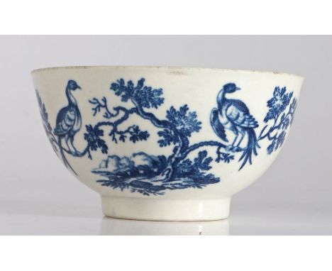 First period Worcester bowl decorated in the "Birds in Branches" pattern, circa 1770 the body transfer decorated in blue with
