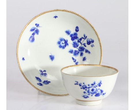 First Period Worcester tea bowl and saucer, circa 1770, the tea bowl and saucer with gilt roundel decorated borders above blu