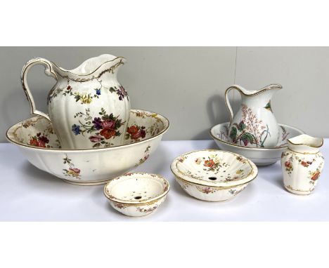 Two jug and basin wash sets, including Minton's, decorated with sprays of flowers (7)