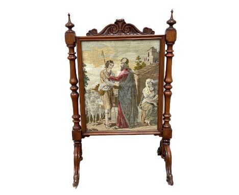 A Victorian mahogany fire screen, with tapestry panel, and turned supports