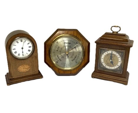 An Edwardian arch topped mantel clock, with fan decoration, aslo another George I style mantel clock and an aneroid barometer