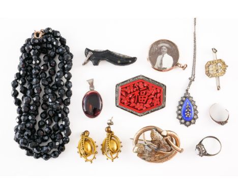 A GROUP OF JEWELLERY (11)Including a black bead necklace, a blue enamelled and colourless paste pendant with a neckchain, one