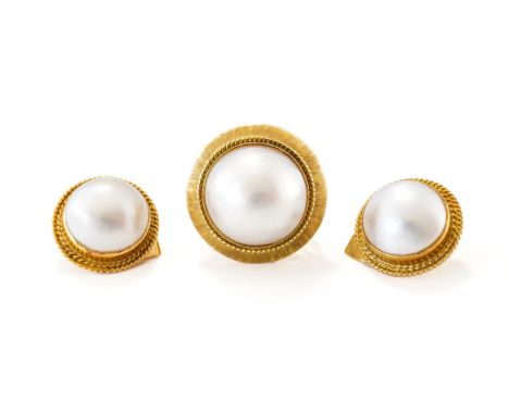 A GOLD AND MABE PEARL RING AND A PAIR OF GOLD AND MABE PEARL EARCLIPS (3)The ring decorated with a ropetwist wirework surroun