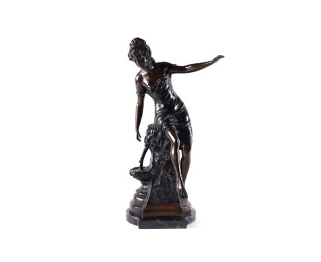 A PATINATED BRONZE SCULPTURE OF A FEMALE PERCHED ON A FOUNTAINLate 20th Century Modelled seated on a fountain or bird table, 