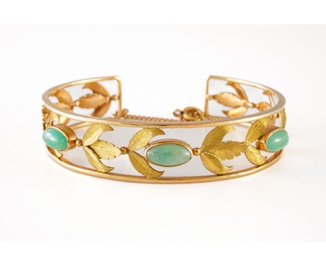 A GOLD AND JADE BANGLEWith foliate pierced decoration, mounted with three marquise oval jades, fitted with a safety chain, un