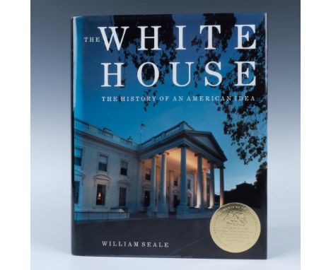336 page hardcover with a dust cover featuring a gold sticker commemorating the 52nd Presidential Inauguration, a vintage map