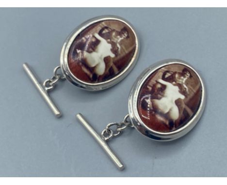 A pair of silver and enamel cufflinks with nude pictorial image, 9g gross