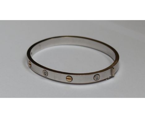 18ct white gold bangle set with three round cut brilliant diamonds, Approx weight 26.4gm
