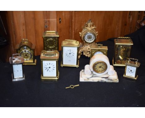 A collection of carriage and mantle clocks to include a quality brass cased carriage clock with bevel edged glass together wi