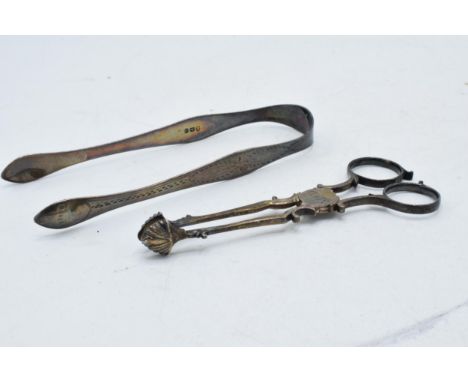 A pair of silver bright cut sugar tongs together with a silver pair of sugar nips (2), 68.8 grams.  